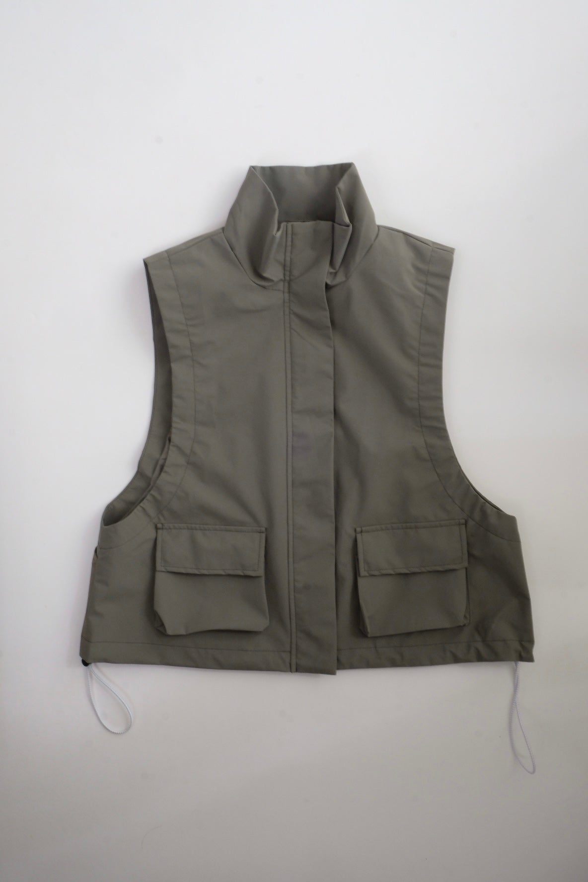 Draw cord high neck vest