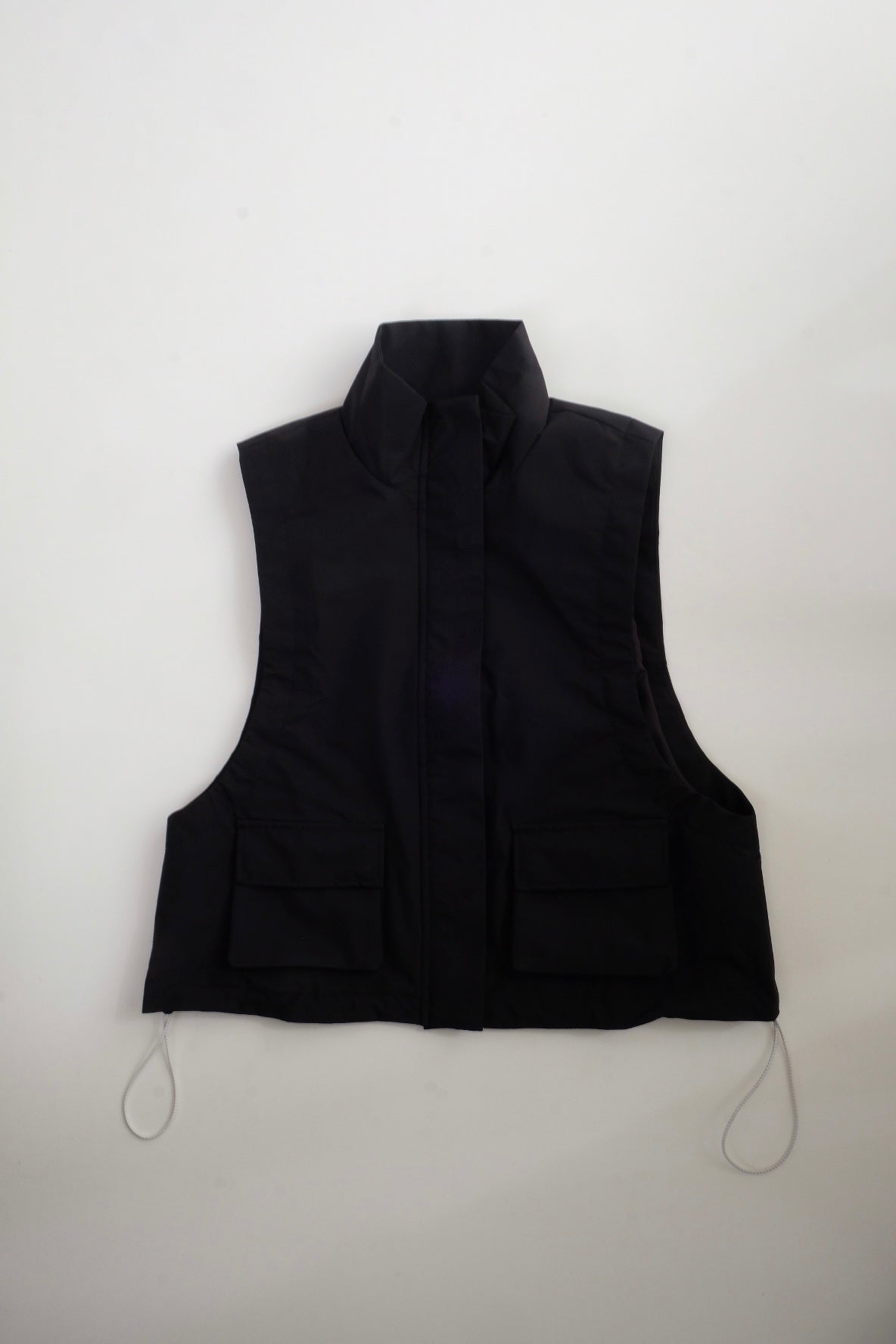 Draw cord high neck vest